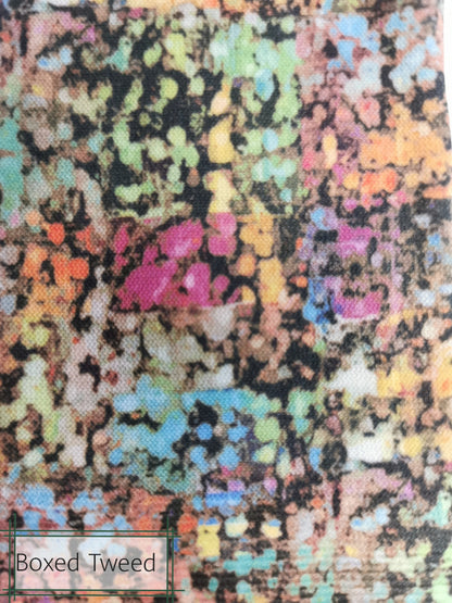Multicolored textured fabric with 'Boxed Tweed' label